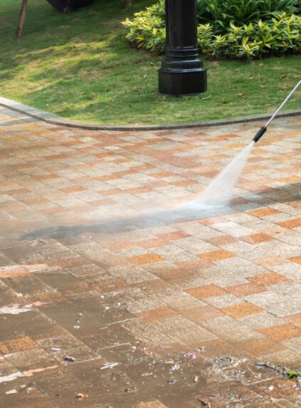 Outdoor floor cleaning with a pressure water jet on street Outdoor floor cleaning with a pressure water jet on street