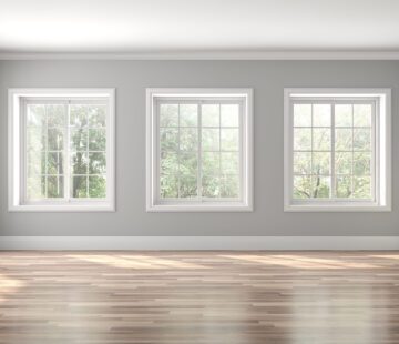 Classical empty room interior 3d render,The rooms have wooden floors and gray walls ,decorate with white moulding,there are white window looking out to the nature view.